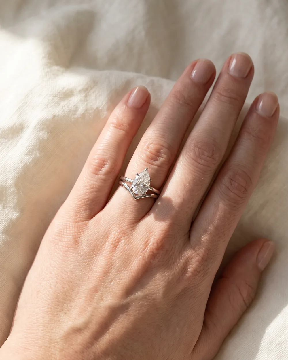 The Pear Pair on a hand, 2 ct lab-grown diamond